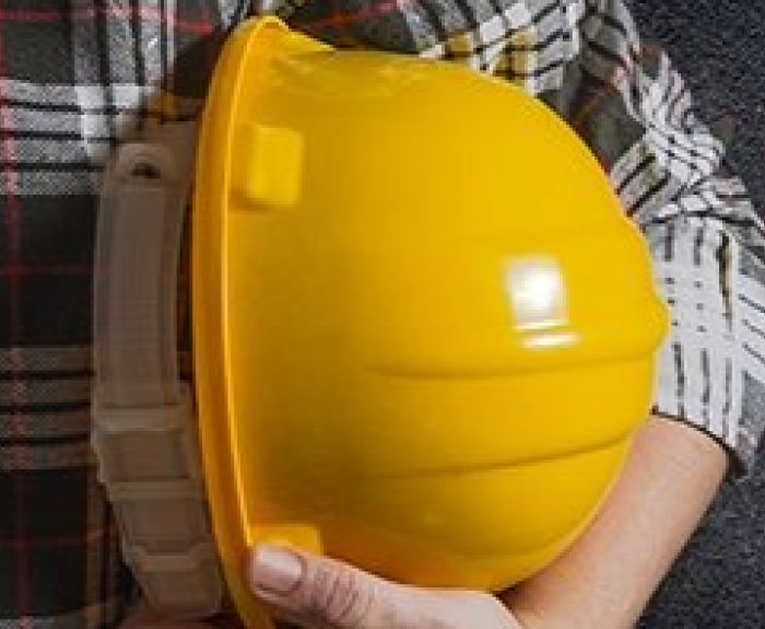 Showing a yellow hard hat